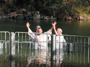 Mikal being baptized