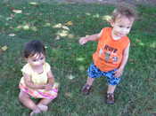 The kiddos playing in the grass