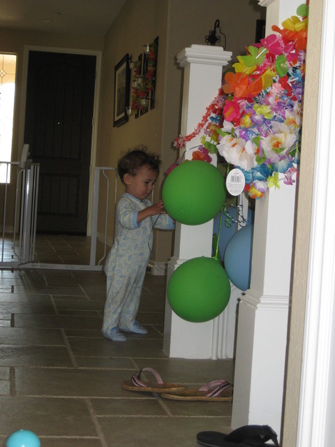 Preston would rather play with balloons than unwrap gifts!