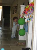 Preston would rather play with balloons than unwrap gifts!