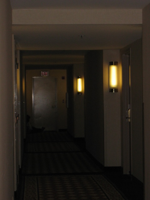 Person sleeping in hallway