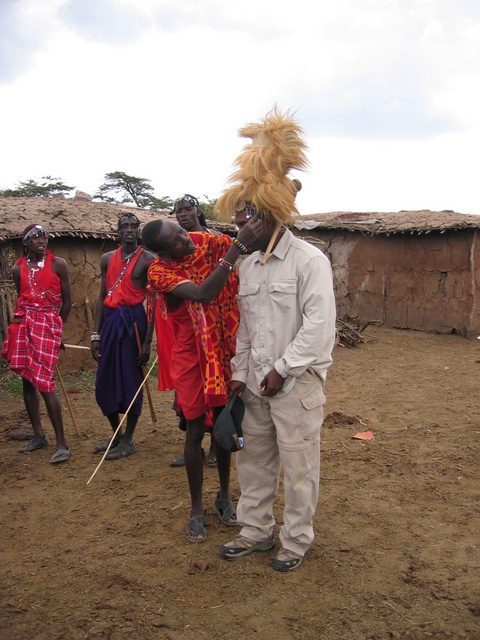 Putting the Lion Headpiece on Mike