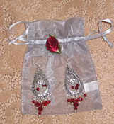 Bridesmaid Gifts - Earings (2 different pairs), Pashminas, Flip Flops.  Junior BM's - Heart Jewelry Boxes, Garnet Earrings, & Garnet Necklaces